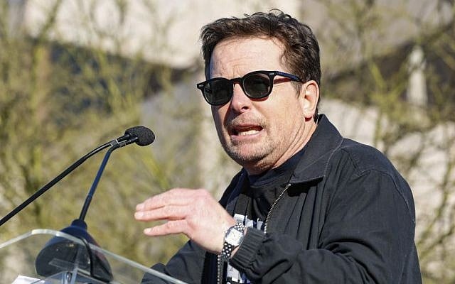 Michael J. Fox speaks at the UTA "United Voices" Rally at United Talent Agency headquarters on Friday, Feb. 24, 2017, in Beverly Hills, California. (Willy Sanjuan/Invision/AP)